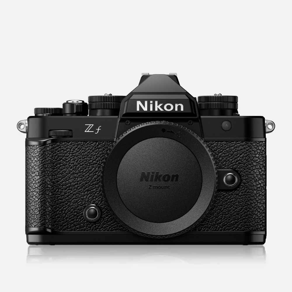 Black Nikon camera body on a white background